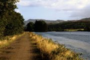 The Caledonian Canal is accompanied by a broad track as it runs towards Fort Augustus.
