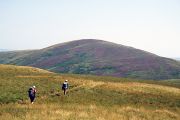 Walkers pass through the Cheviot Hills on their way to the remote farm at Uswayford.