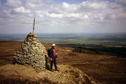 Paddy Dillon stands beside an old cairn on the Ridge of Capard in the Slieve Bloom.
