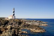 The candy-striped lighthouse on the rugged Cap de Favàritx.